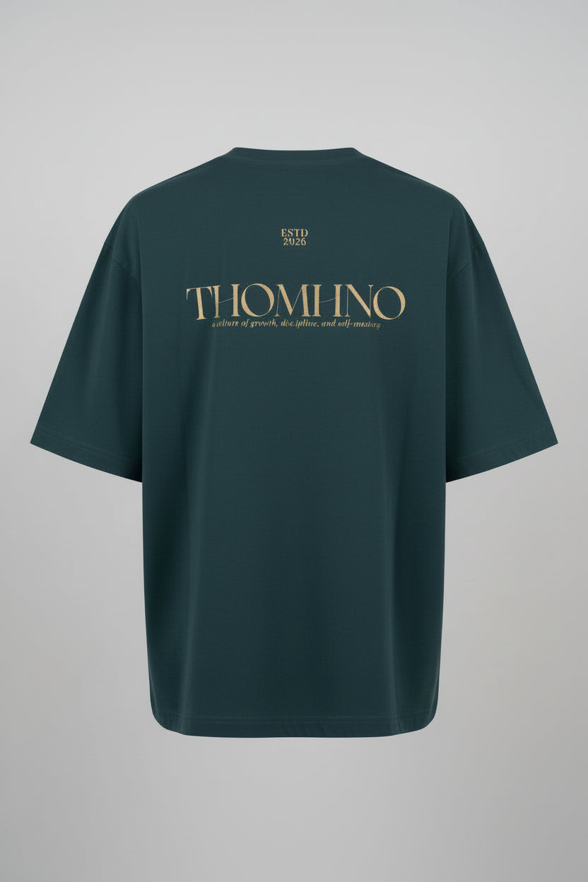 Green t-shirt with gold text on the back against a black background