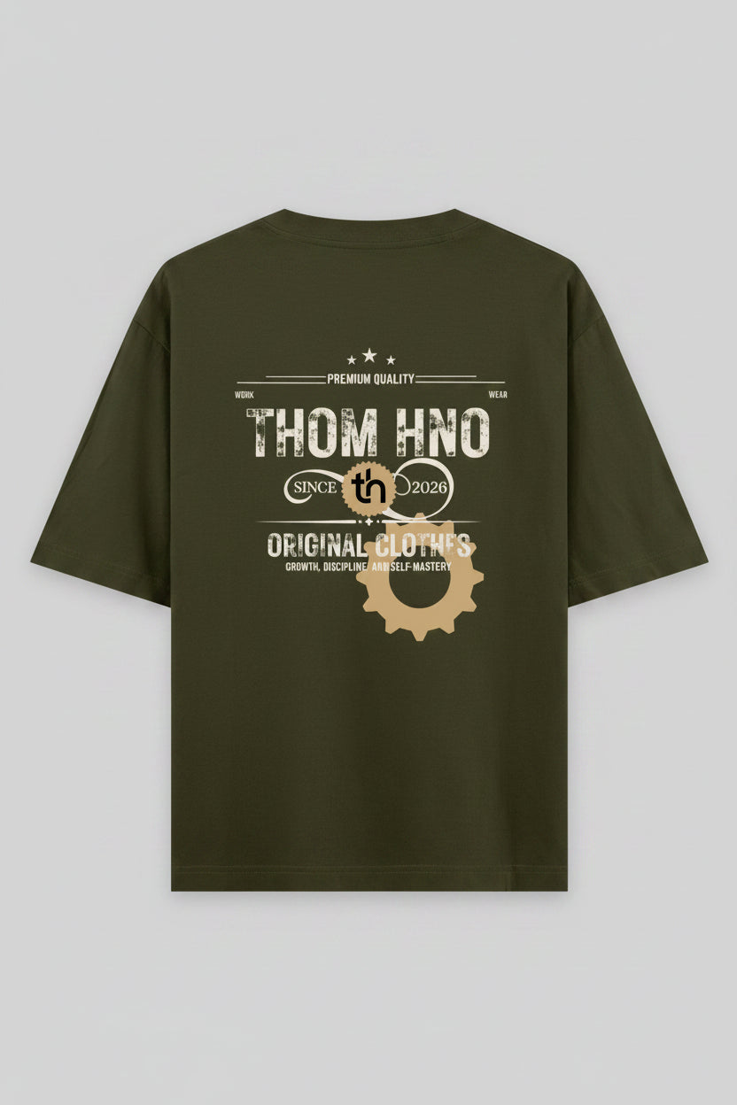 Green t-shirt with 'THOM HNO' branding on the back against a black background