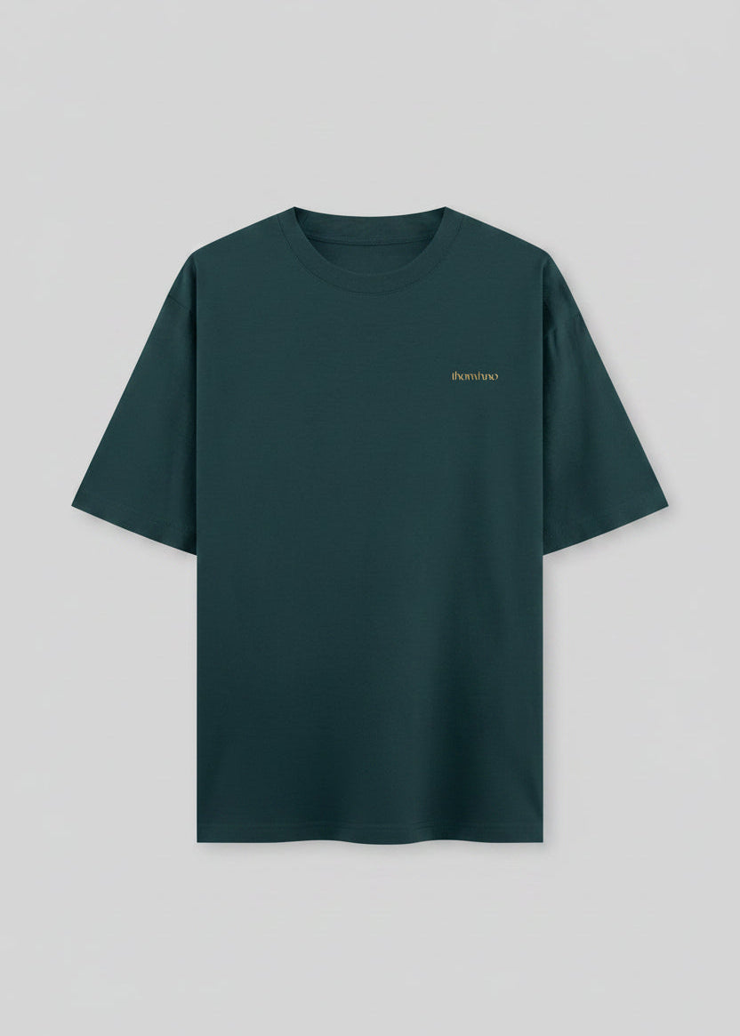 Teal t-shirt with a small logo on the chest against a black background